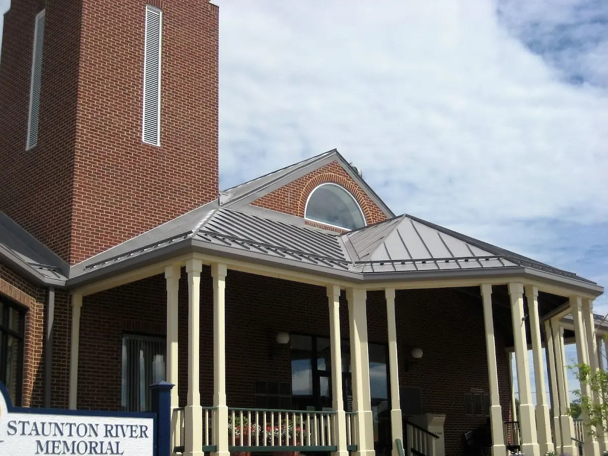 Skilled roofing craftsmen working on a residential roof in Torrington